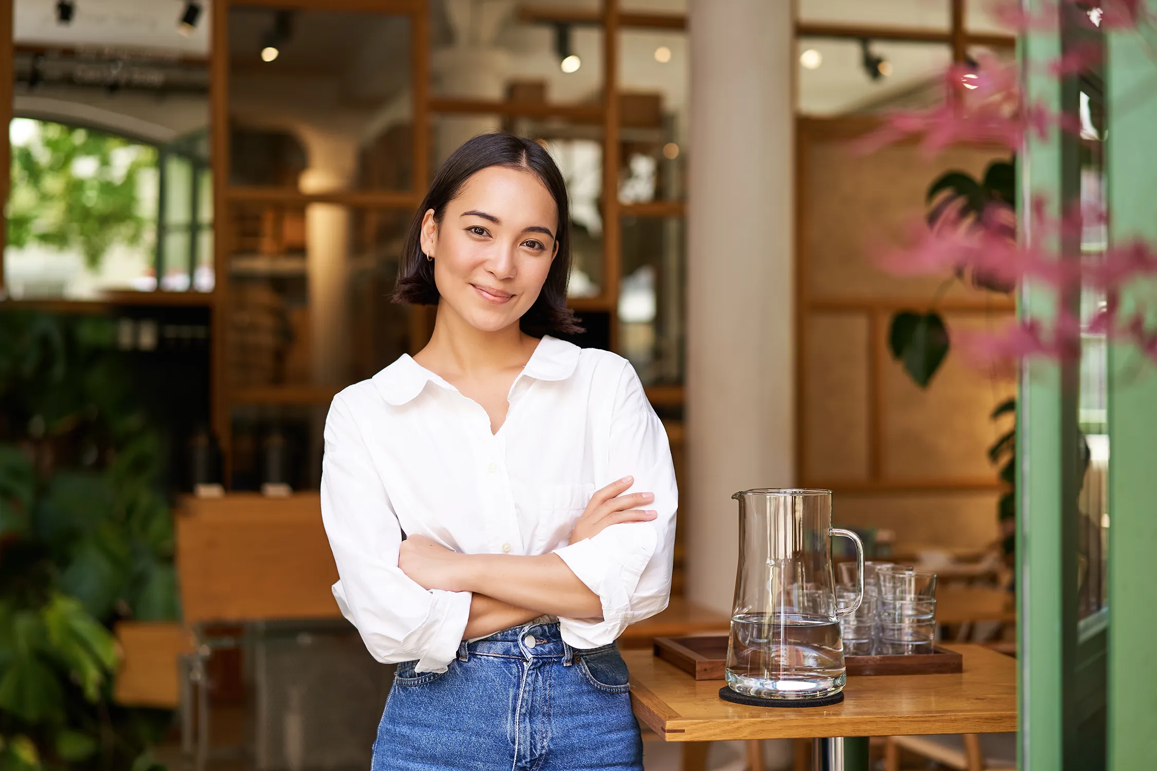 Business owner portrait in a bright cafe workspace
